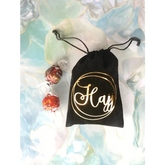 Zwarte drawstring tas met gouden cirkel en script voor grote Hajj cadeautas